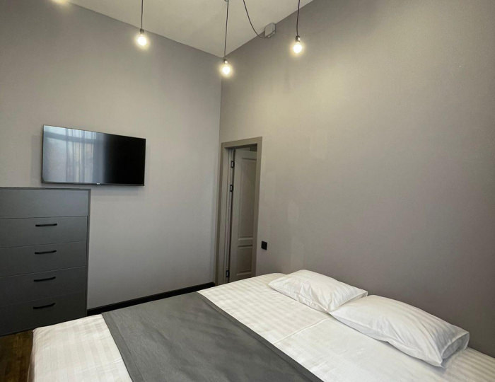 2-комнатные апартаменты люкс с 1 односпальной и 1 двуспальной кроватью - Апарт-отель «Лофт Апарт» Барнаул